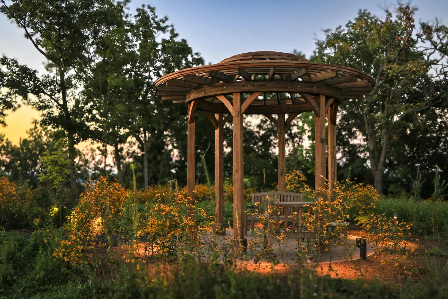Wooden Dome Pergola (Options: 16' Diameter, Without Deck, California Redwood, Open Roof with Slats at 6", 9' Posts, No Electrical Wiring Trim, 6-Post Anchor Kit for Concrete, Transparent Premium Sealant). Photo Courtesy of P. Kawalek of Black Earth, Wisconsin.