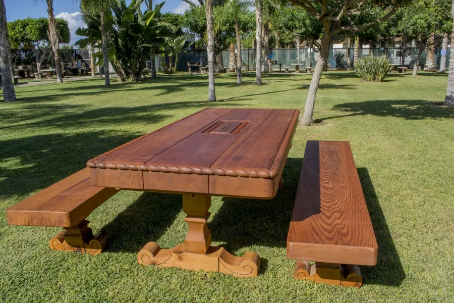 Trestle Natural Wood Outdoor Table (Custom designed trestle designed table in Old-Growth Redwood with massive timbers and custom carving and engraving.)