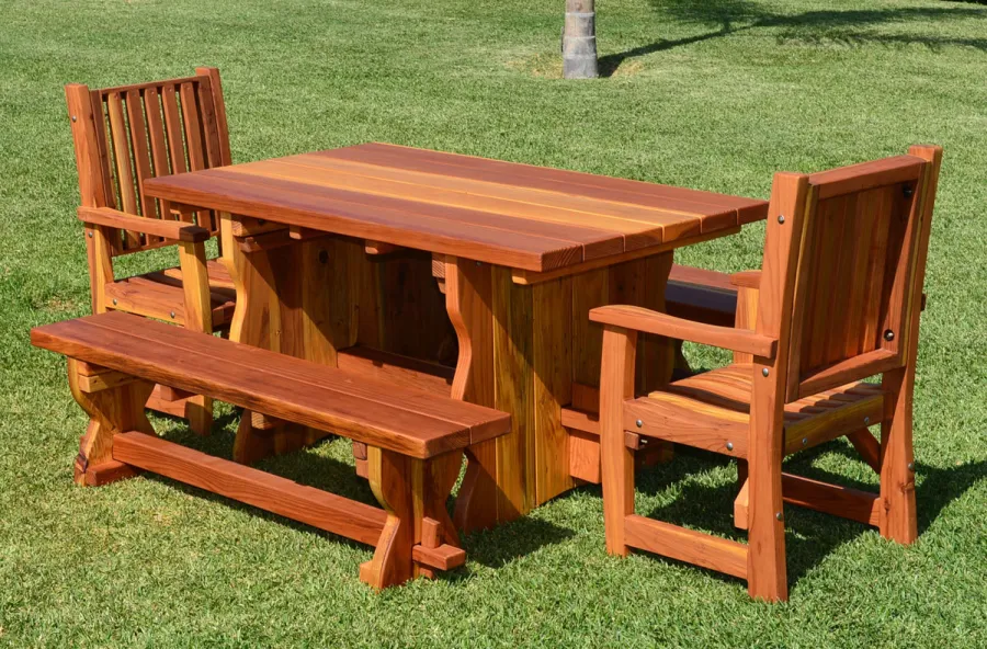 Trestle Natural Wood Outdoor Table (Options: 5' L, 34 1/2'' W Tabletop, Benches & End Armchairs, Redwood, Standard Tabletop, Slightly Rounded Corners, Ruth Chairs, 1 Full Length Side Benche Per Side, No Umbrella Hole, Transparent Premium Sealant). 