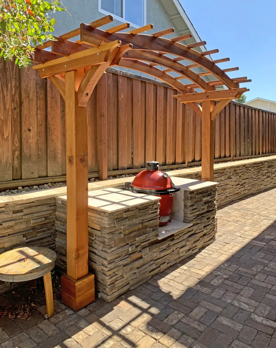 Two-Post Arched Wood Arbor (Options: 10' x 4', California Redwood, 6" x 6" Posts and 2" x 6" Roof Timbers, 6" Overhang Instead of the Standard 12", 7.5ft H Posts, 2-Post anchor Kit for High-Wind, No Privacy Panel, Transparent Premium Sealant). Photo Courtesy of B. Elliott of Concord, CA.