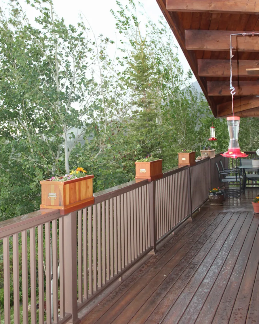 Window Box Planters (Options: 24" L, 9" W, 9" H, Douglas-fir, With Strips for Placement Over Railings, Transprent Premium Sealant). Photo Courtesy of Mr. Paul Ferguson of Casper, Wyoming. Note: Handles on the ends were added by customer.
