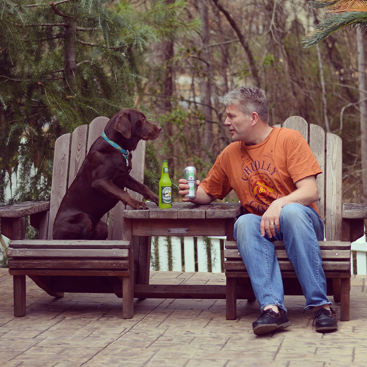 Adirondack Vignette Settee. Photo Courtesy of Magnus Rundqwist & Scout (the Chocolate Lab). Photo shows finish after 5 years out in the weather...