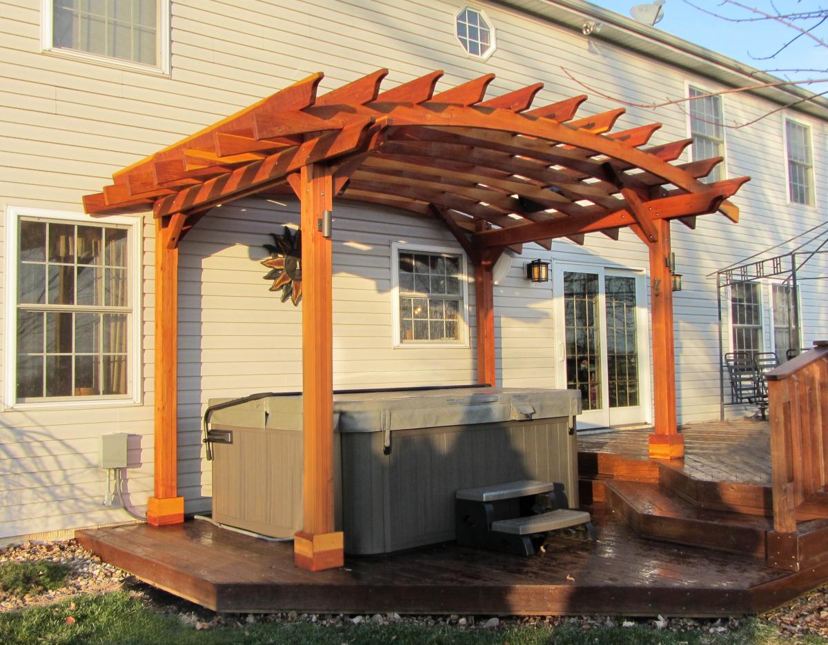Arched Open Sky Pergolas (Options: 10' L  x 14' Arc W, California Redwood, Unattached, No Electrical Wiring Trim, Arched Roof without Lattice Panels, 4-Post Anchor Kit for Wood, No Ceiling Fan Base, No Privacy Panels, No Curtain Rods, 9'  Post Height [custom length for 2 posts], Transparent Premium Sealant). Photo Courtesy of Doug K. of Erie, Michigan.