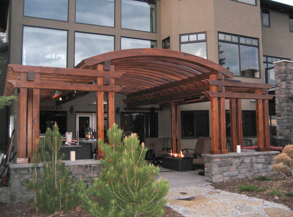 Custom Wooden Pergola (Options: 24' x 22', California Redwood, Open Roof with Rafters at 15", 9' Post Height [Front Posts 2' Shorter], Transparent Premium Sealant). Photo Courtesy of Kelly Fraser of Okotoks, AB, Canada.