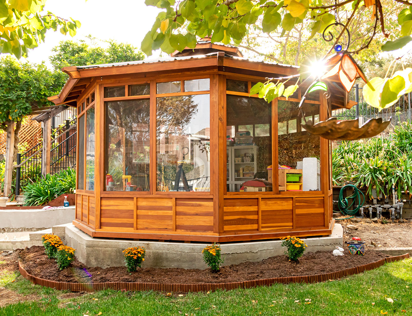 Octagonal Sunroom Gazebo (Options: 16' Diameter, Internal Deck, California Redwood, 24" H Siding Below Windows, 4 Standard Window Panels & 3 Custom Panels, Clear Acrylic, 1 Ceiling Fan Base, 1 Set of Doors, Transparent Premium Sealant). Photo Courtesy of D. Coons of Morgan Hill, California.