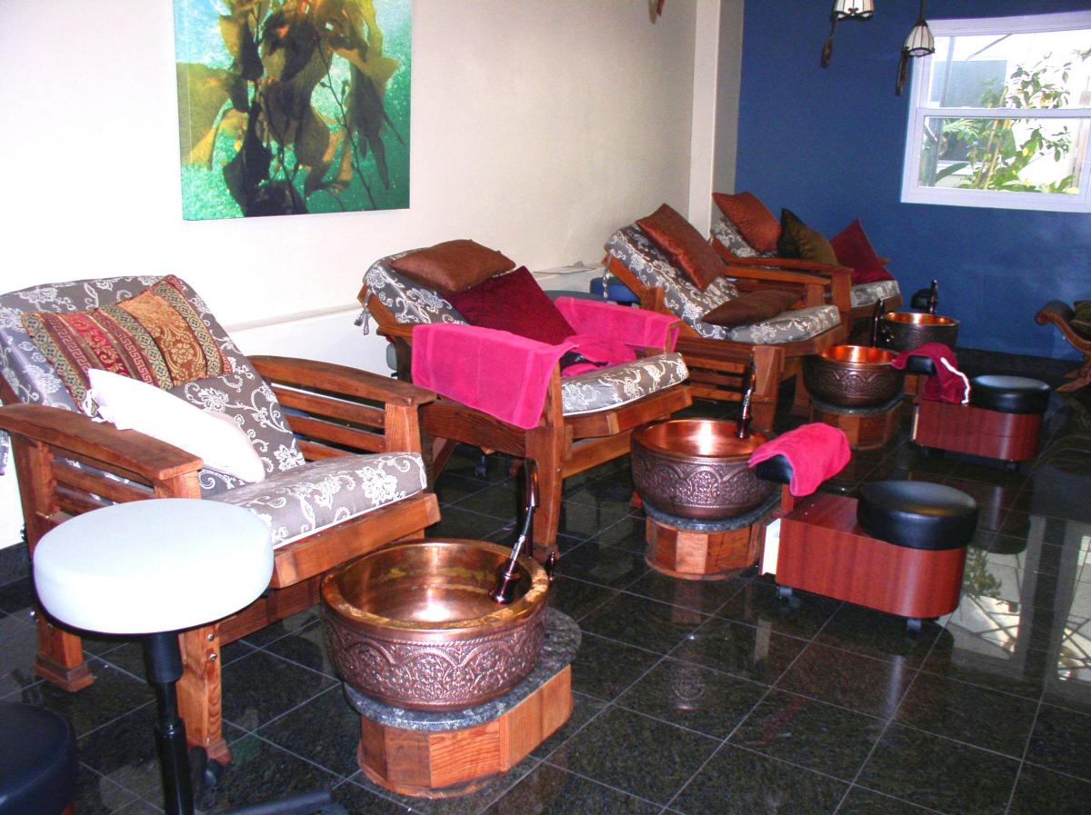 Reclining Redwood Easy Chair (Options: Old-Growth Redwood, Custom 4" Thick Cushions, Transparent Premium Sealant) - fully reclined position. Photo Courtesy of Oasis Nail Spa - Burbank, CA.