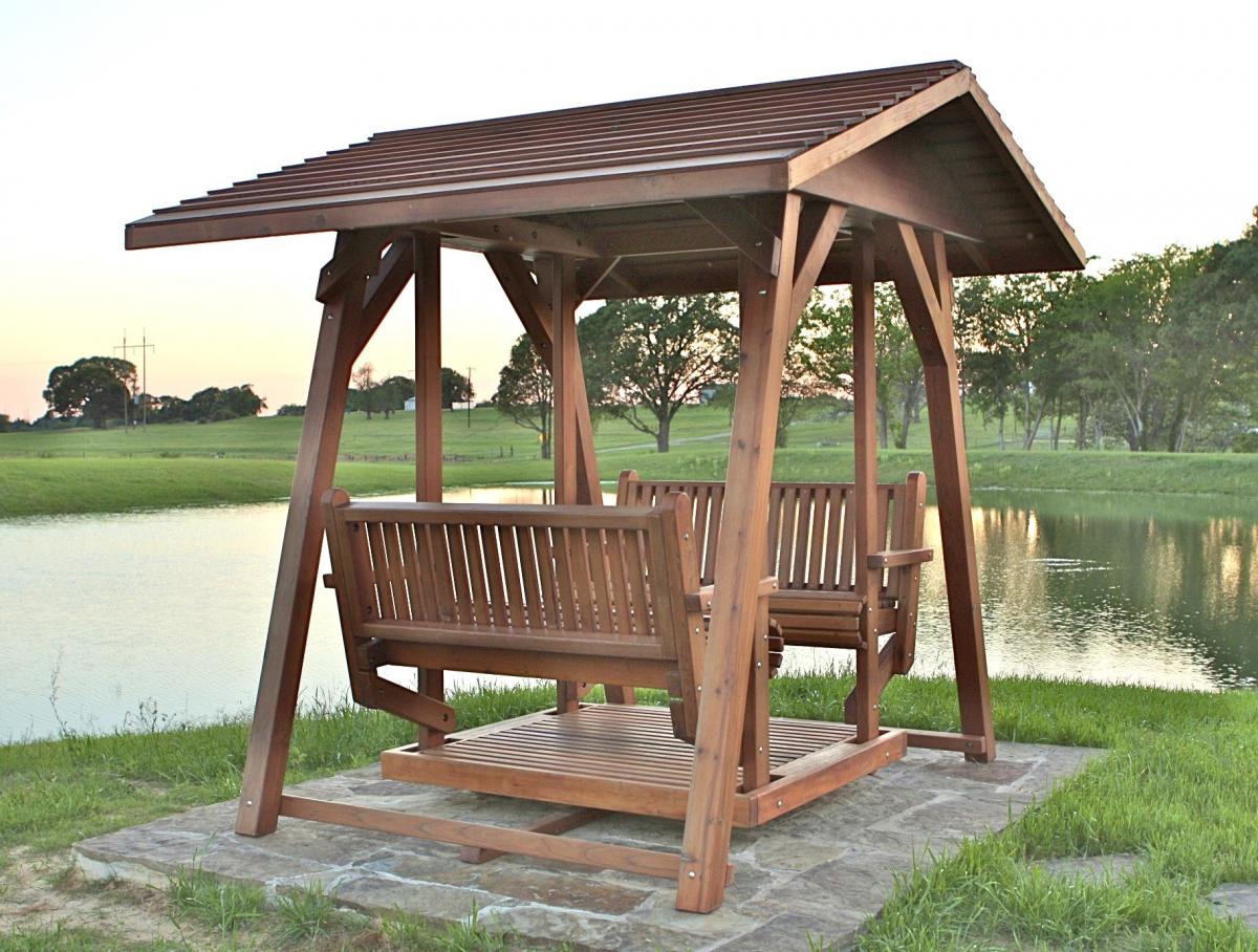 St. Anthony's Face to Face Gliders (XW Size, Old-Growth Redwood, No Kid's Platform, XW Roof, No Engraving, Transparent Premium Sealant).  Photo Courtesy of Ms. Kathy Gillespie of Athnes, TX.