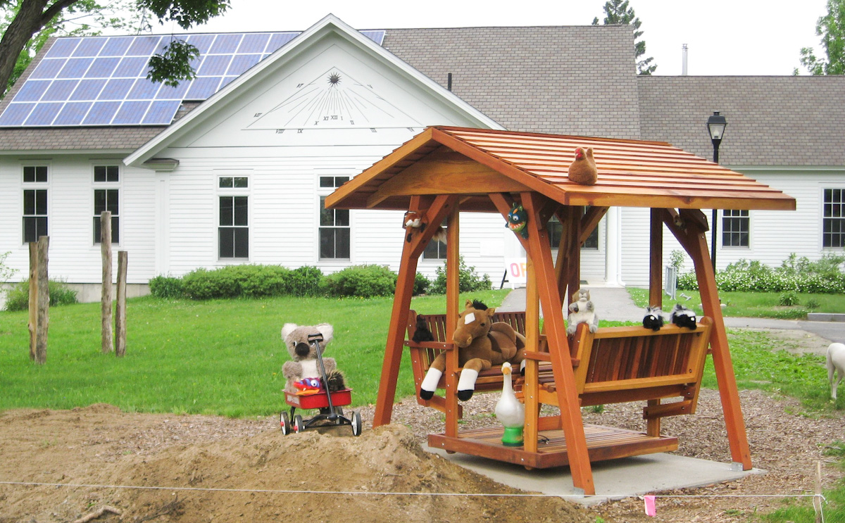 St. Anthony's Face to Face Gliders (XW Size, California Redwood, No Kid's Platform, XW Roof, No Engraving, Transparent Premium Sealant).